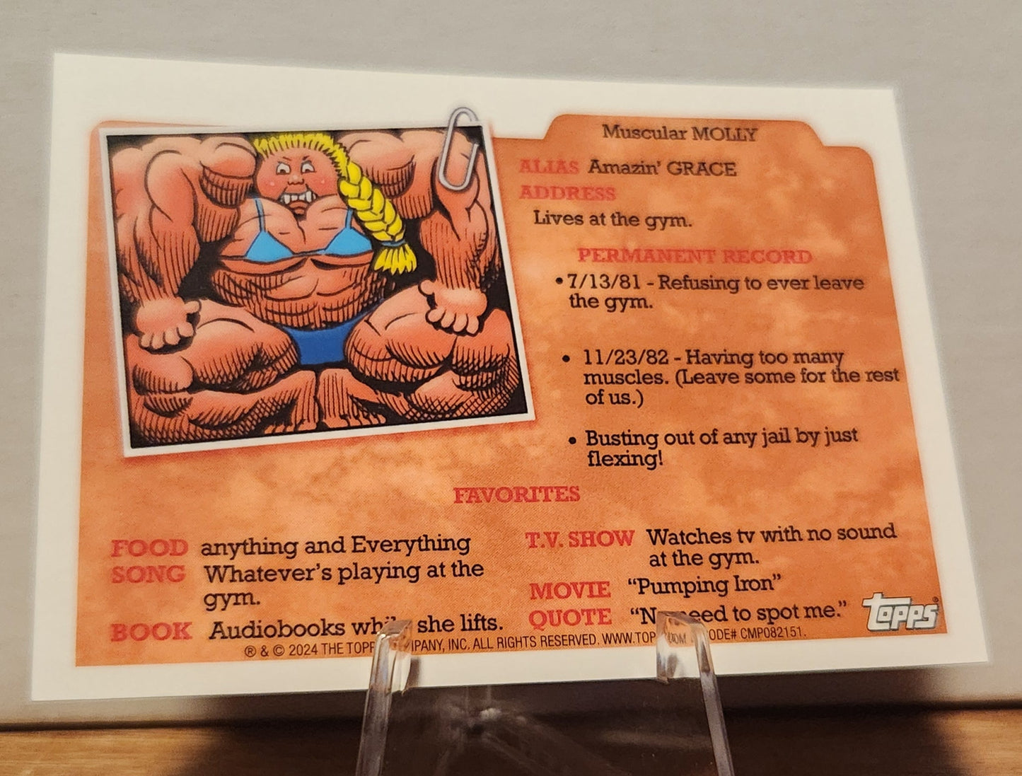 AN-1C MEDIEVAL MAX- GARBAGE PAIL KIDS-REFRACTOR card featuring Muscular Molly from Topps with details on her character