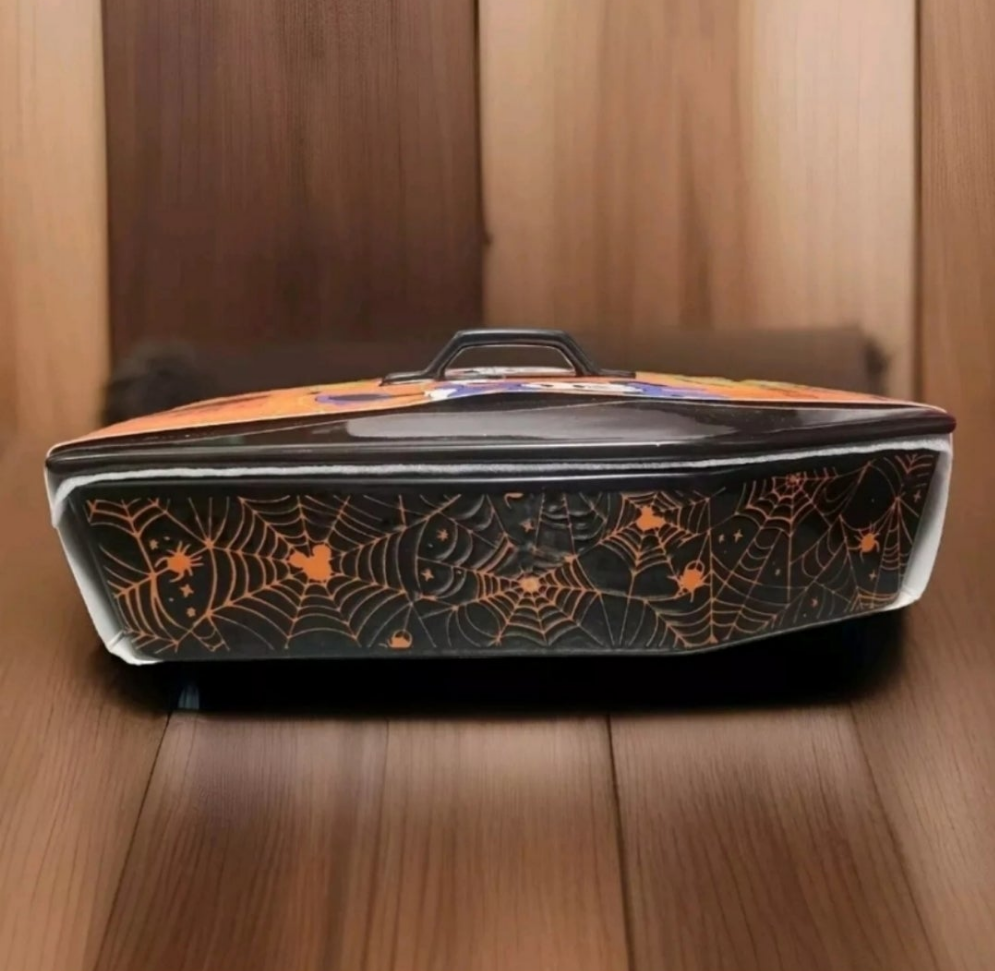 Mickey and Minnie coffin dish featuring spider web design for Halloween-themed decor