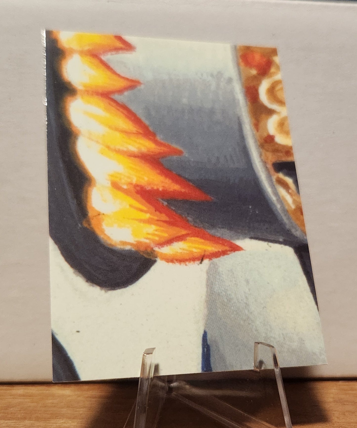 Max Stacks trading card featuring vibrant colors and dynamic artwork on a display stand