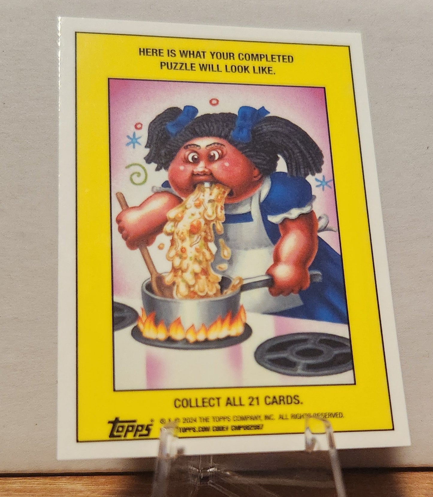 GPK card featuring a character cooking and spilling food with the phrase Mickey Mouths rare card