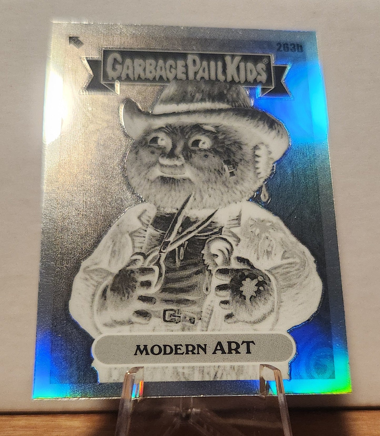 Garbage Pail Kids modern art card featuring a quirky character with a cowboy hat and scissors