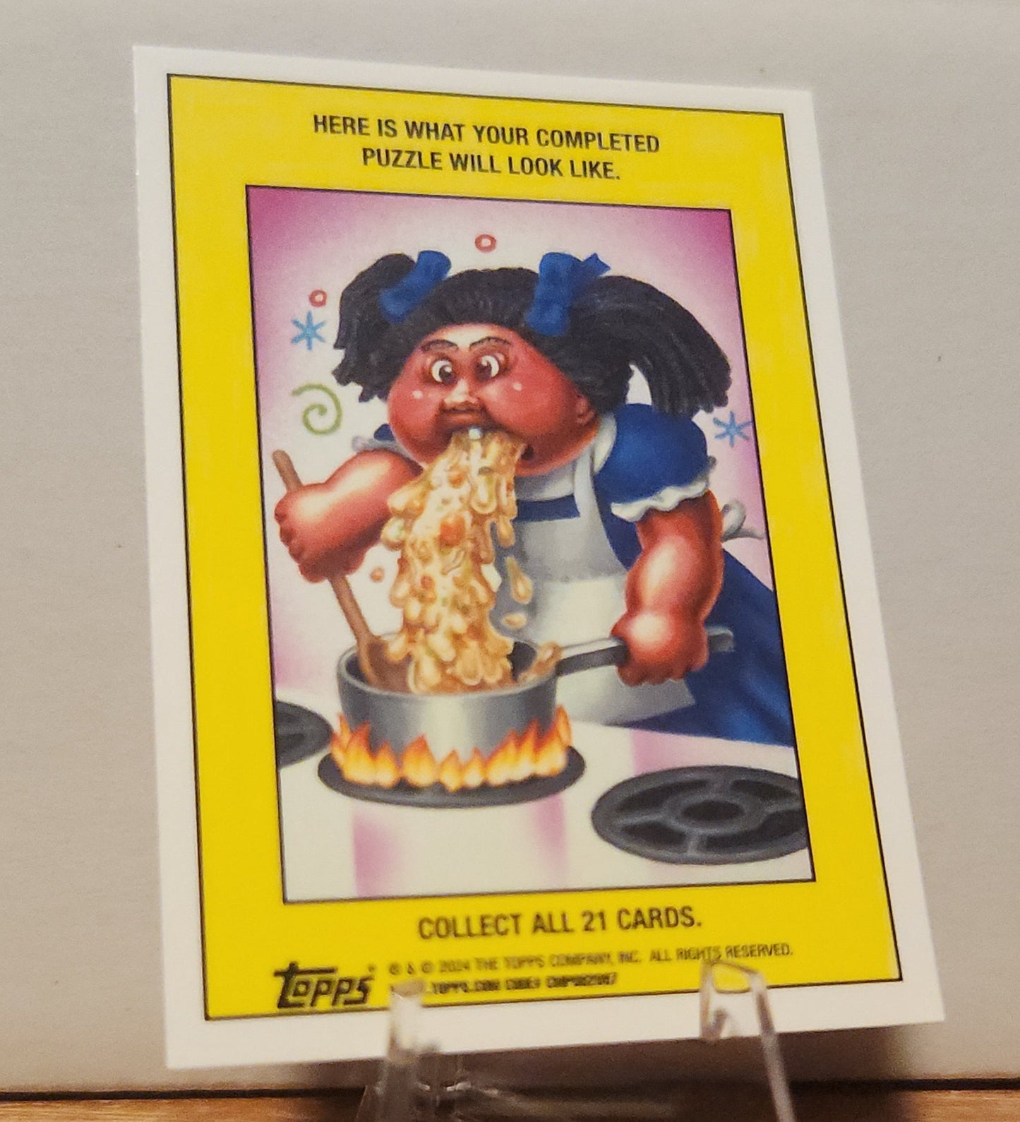 TOPPS GPK Purple Refractor collectible card featuring a character cooking a pot of noodles