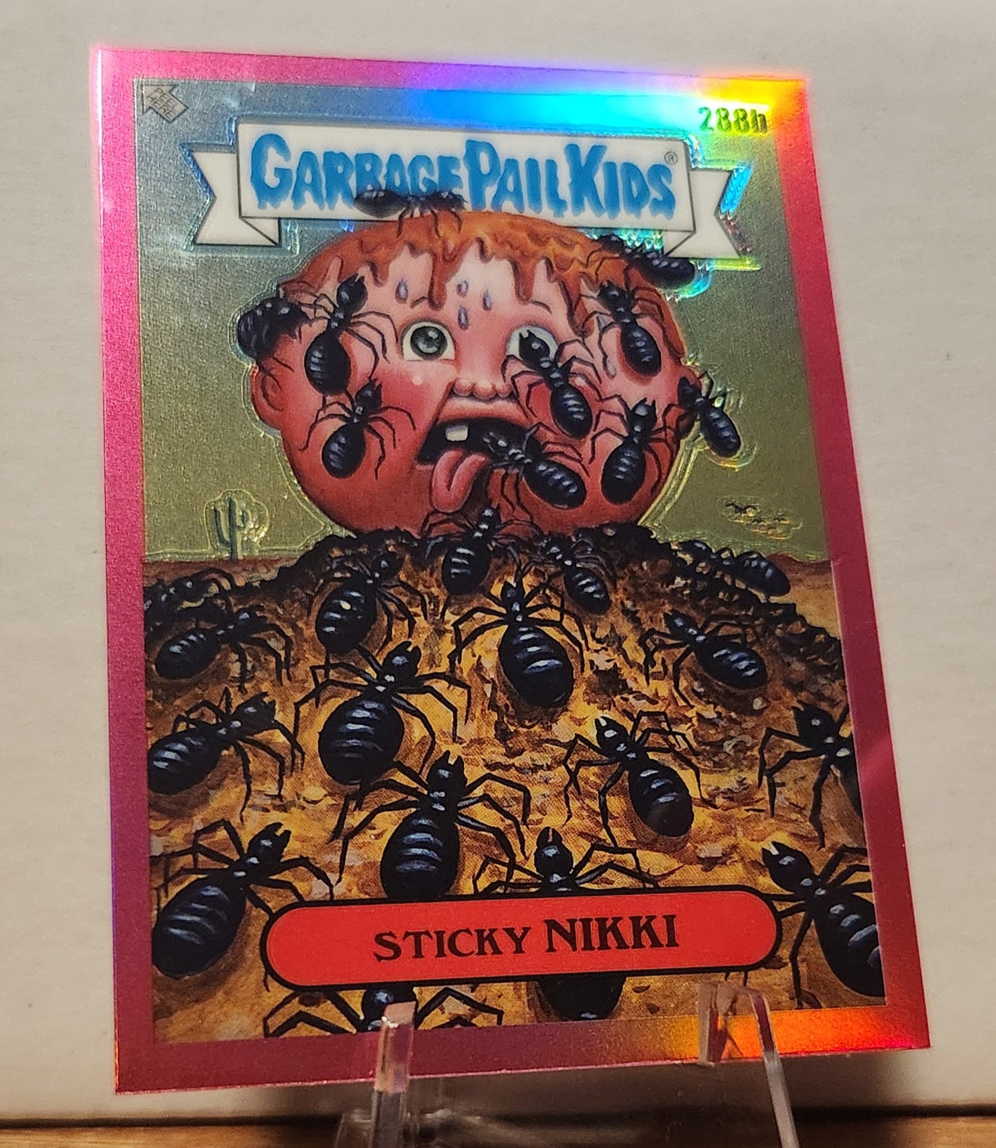 Garbage Pail Kids Sticky Nikki trading card featuring a character surrounded by ants on a glittery background