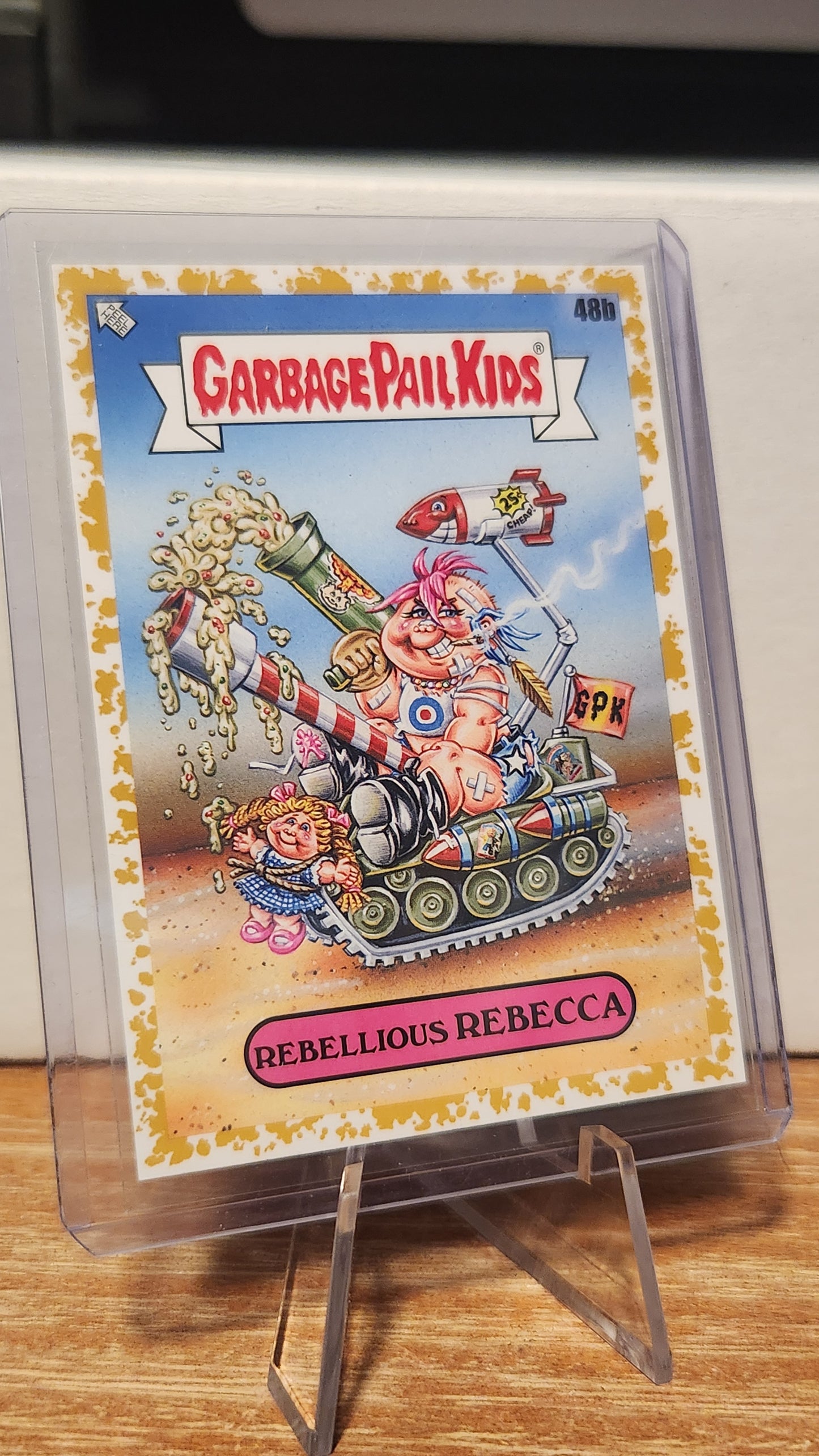 48B REBELLIOUS REBECCA - GOLD BORDER 7/50