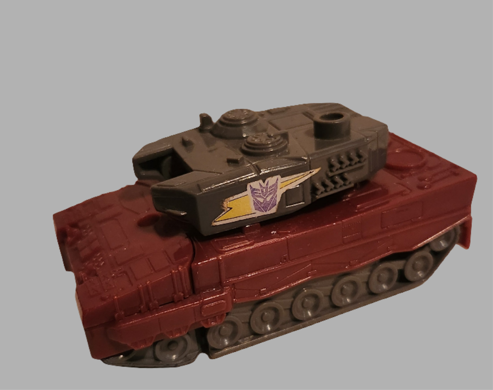 Transformers Quake toy featuring a detailed tank design with military colors