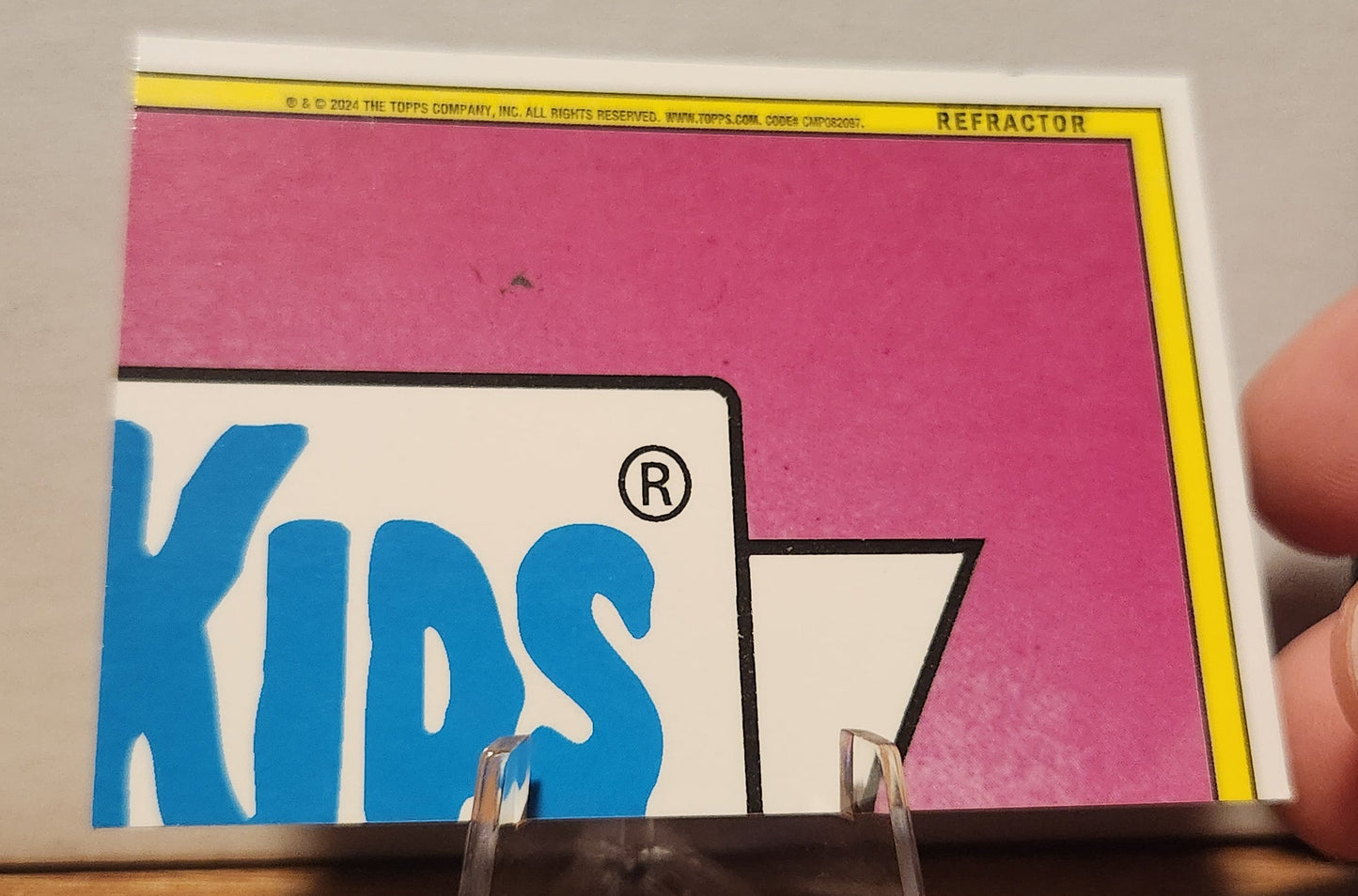 Back of GPK card 254A CHRIS MESS- GARBAGE PAIL KIDS-REFRACTOR showing colorful design and logo