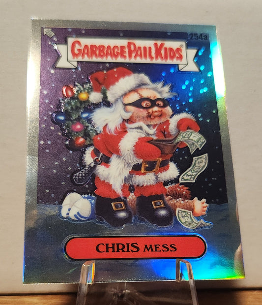 254A CHRIS MESS- GARBAGE PAIL KIDS-REFRACTOR card featuring a Santa character with money