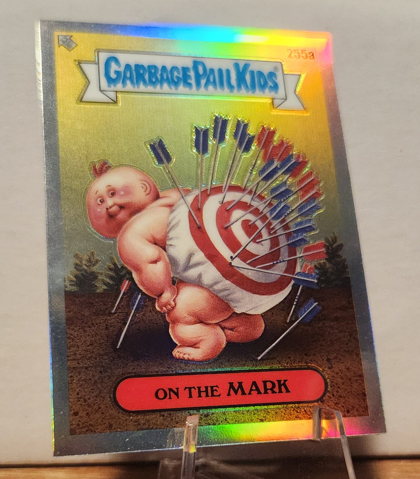 255A ON THE MARK GARBAGE PAIL KIDS-REFRACTOR card featuring a baby with a target on its back and arrows.