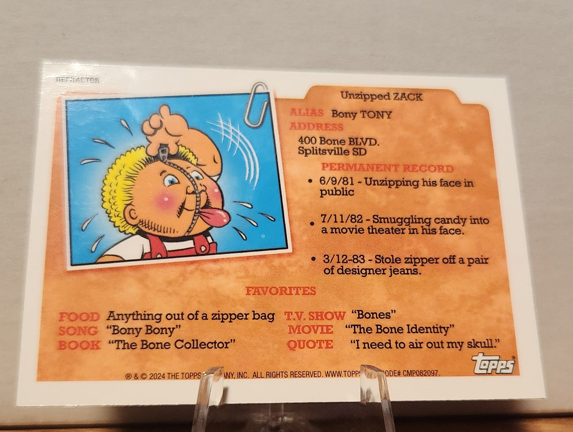 AN-6A HAYLEY COMET- GARBAGE PAIL KIDS-REFRACTOR featuring Unzipping Zack card with colorful artwork