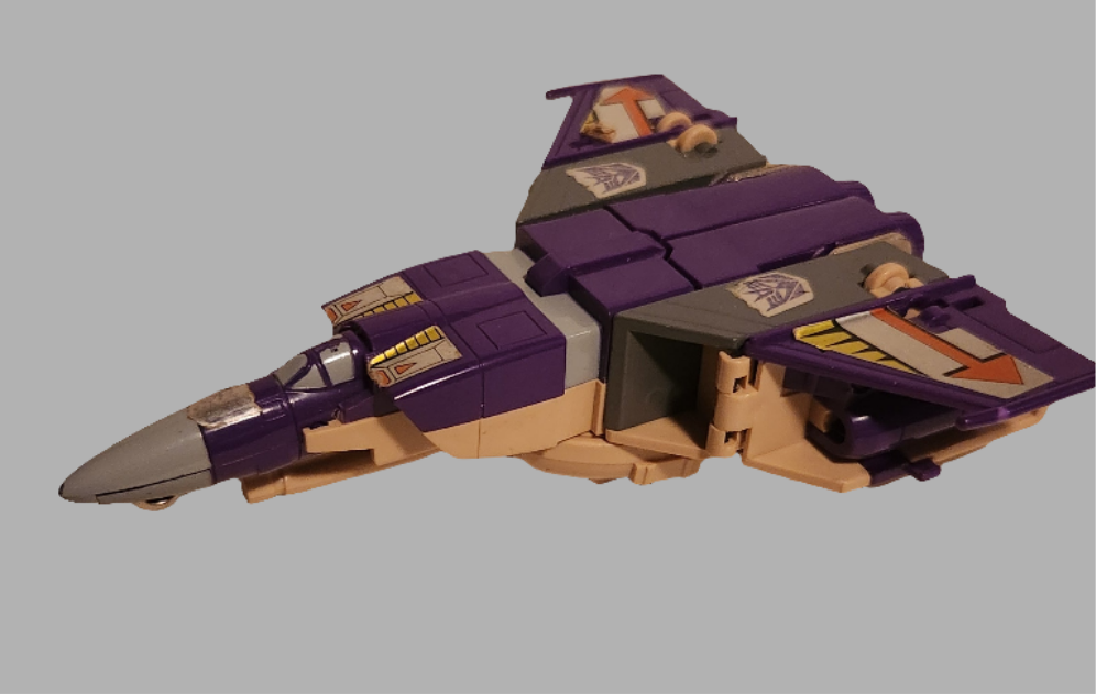 Transformers Blitzwing Transformer figure in jet mode with purple and gray design details
