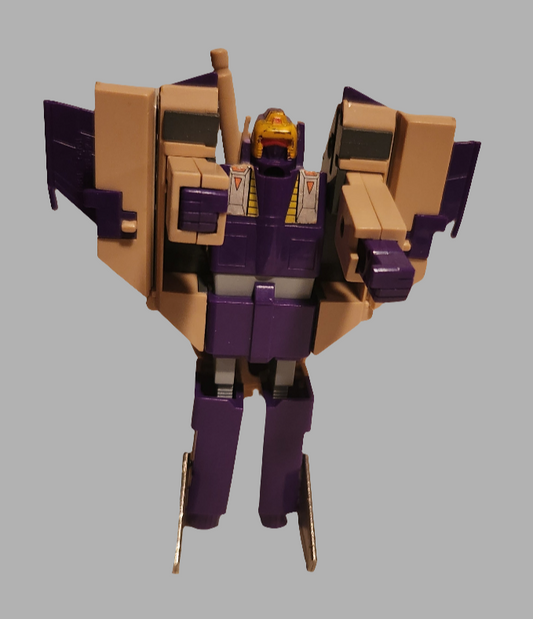 Blitzwing Transformer figure in purple and tan colors with articulated limbs and iconic design