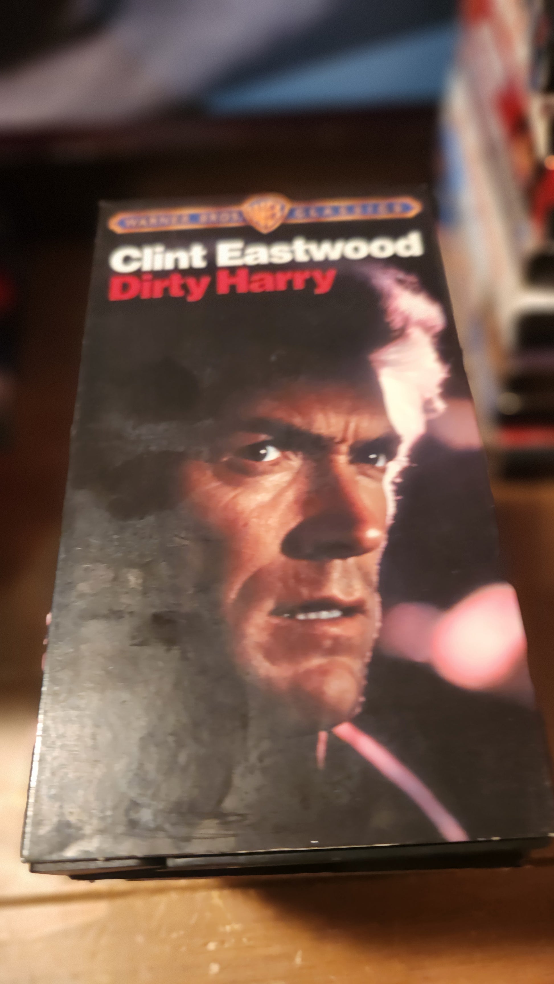 Lawrence's Collectibles Dirty Harry VHS for sale featuring Clint Eastwood close-up on vintage tape cover