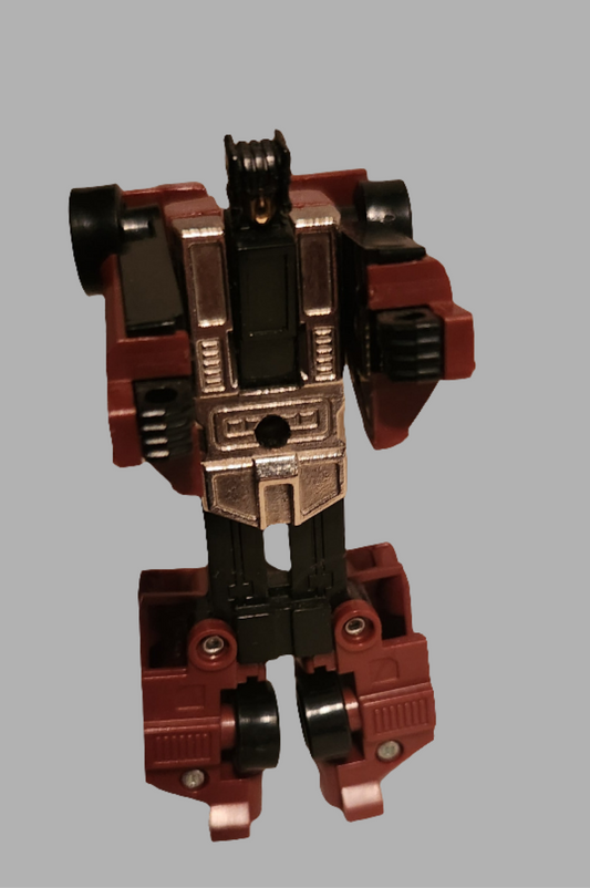 Dead End Stunticons Transformers toy featuring a detailed vintage robot design with red and black colors