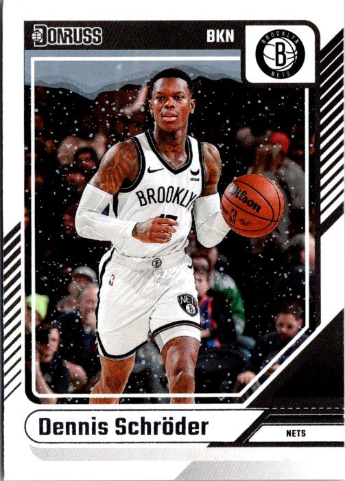Dennis Schröder trading card featuring him playing for the Brooklyn Nets with a dynamic action shot