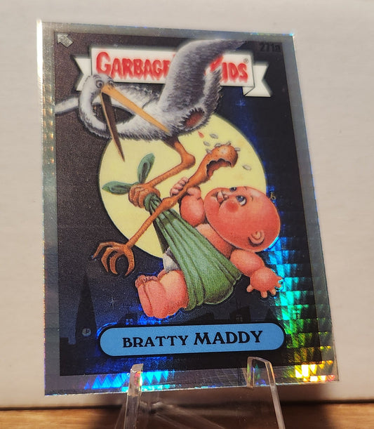 Garbage Pail Kids Bratty Maddy trading card featuring a humorous illustration of a baby and a stork
