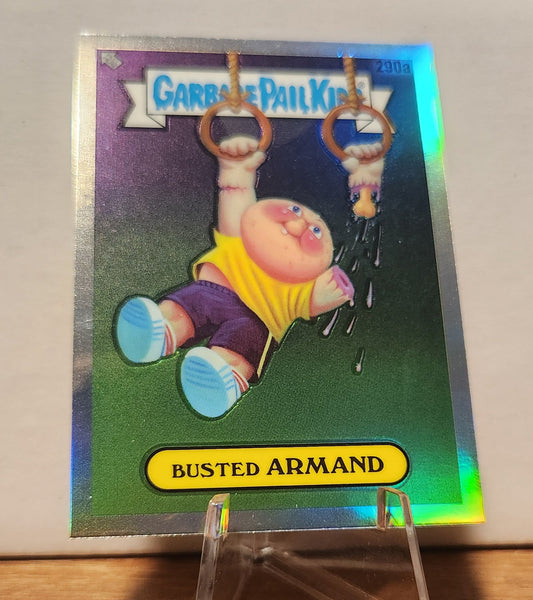 Garbage Pail Kids Busted Armand card featuring a child hanging from rings with a playful design
