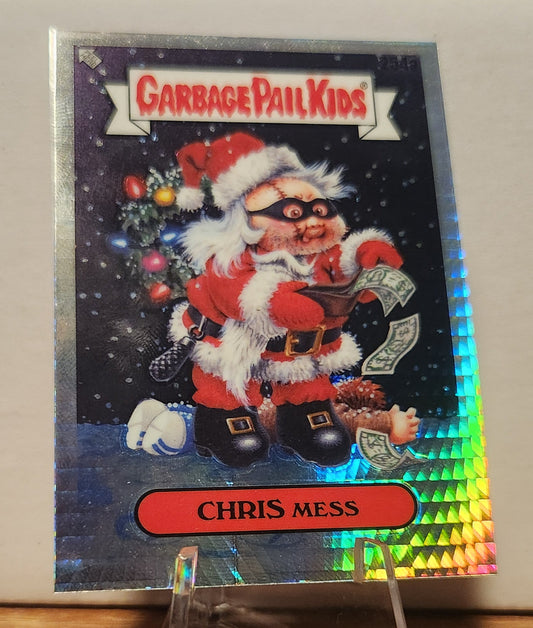 Garbage Pail Kids Chris Mess card featuring a festive character in a Santa outfit with colorful details