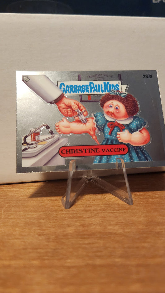 Garbage Pail Kids Christine Vaccine card featuring a humorous illustration of a girl receiving a vaccine