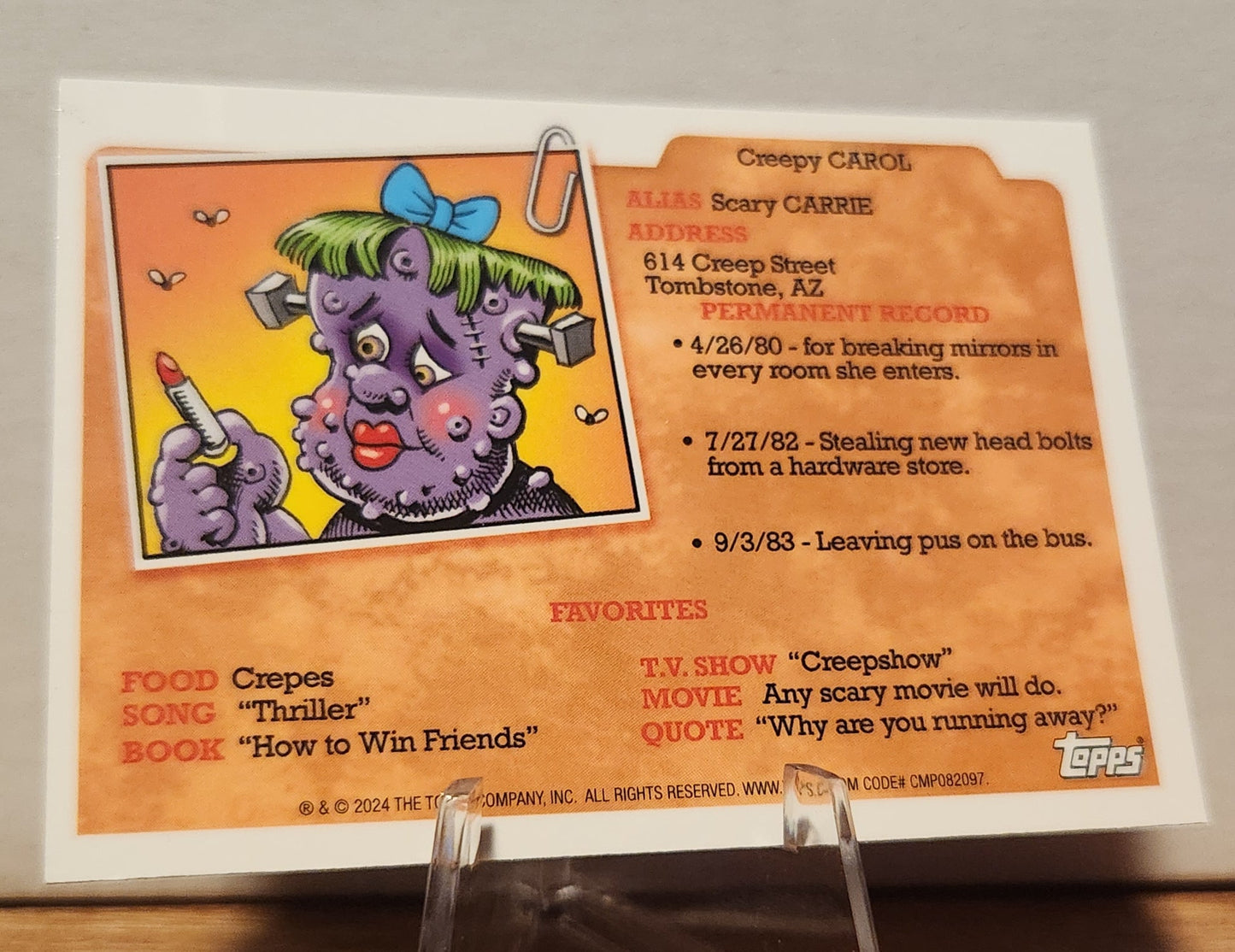 GPK CARD featuring Creepy Carol, an AN-2A TIA POT magenta refractor with cartoonish details