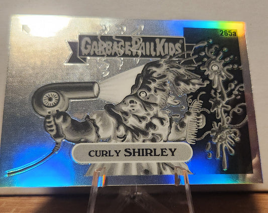 Curly Shirley refractor card from Garbage Pail Kids featuring a character with a hairdryer and colorful background