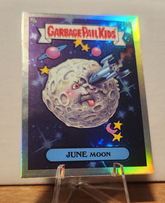 Garbage Pail Kids June Moon card featuring a whimsical moon character and colorful space background
