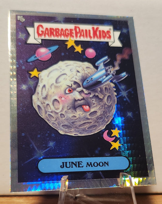Garbage Pail Kids June Moon collectible card featuring a cartoon moon with a spaceship