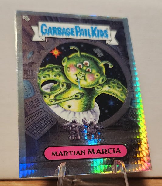 Garbage Pail Kids Martian Marcia card featuring a green alien with three eyes and a playful expression