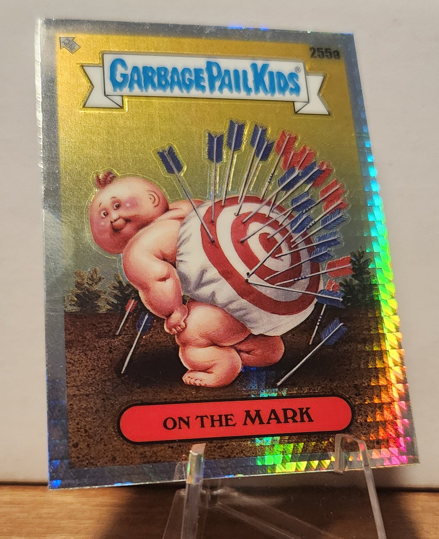 Garbage Pail Kids Prism Refractor card featuring a target-themed character with arrows in its back