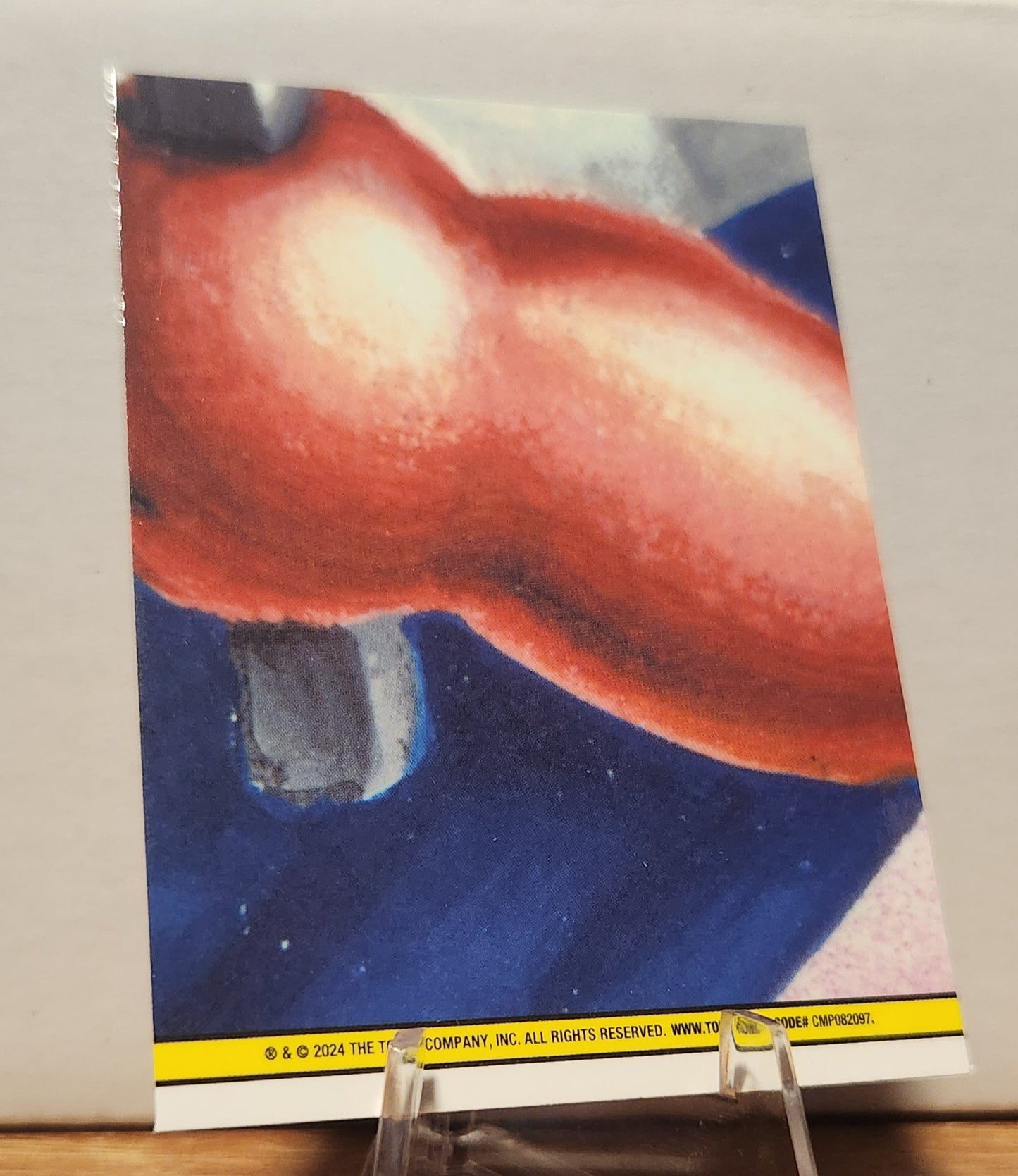 Back view of a GPK card featuring vibrant colors and details of the prism refractor trading card design