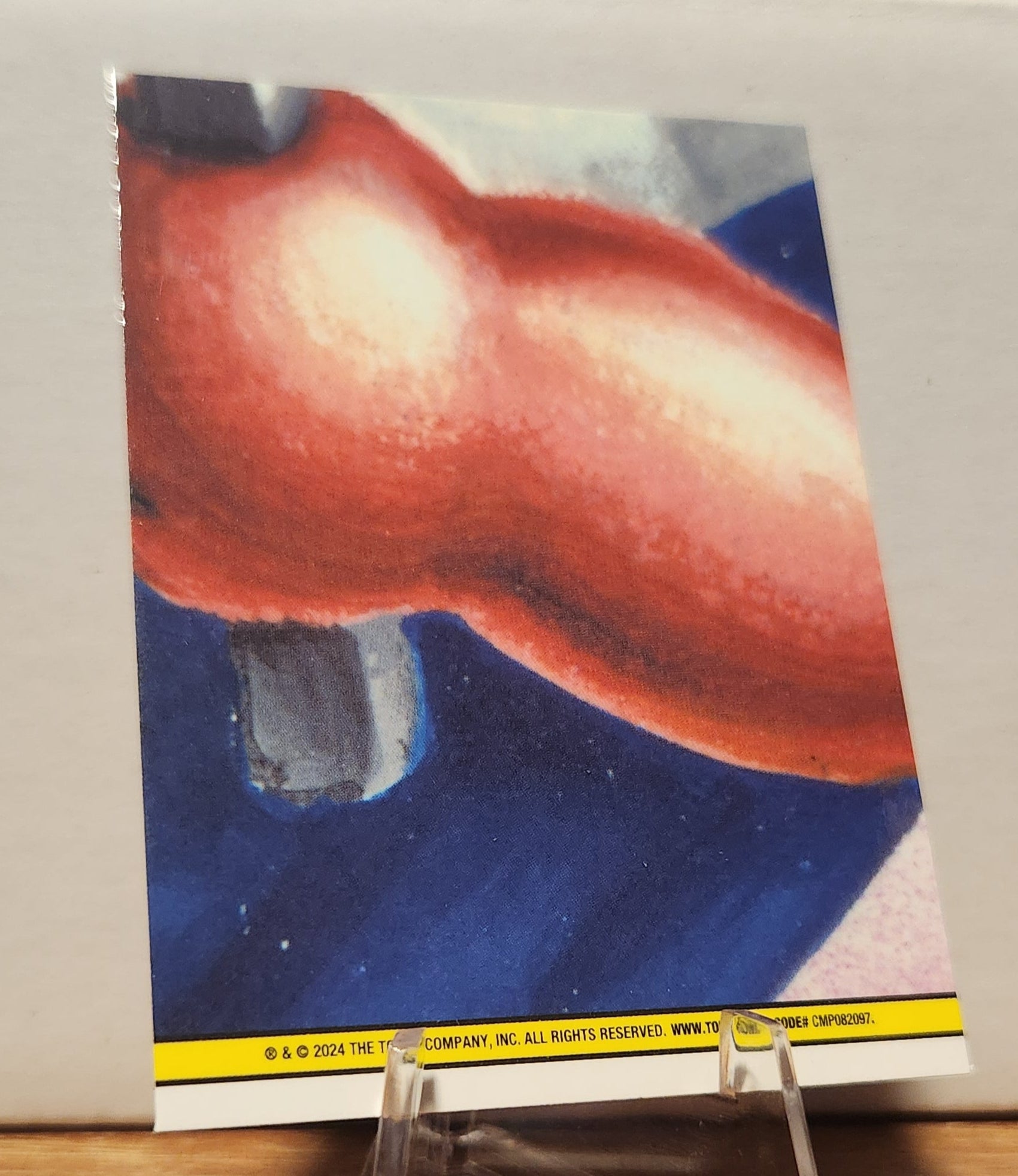 Back view of a GPK card featuring vibrant colors and details of the prism refractor trading card design