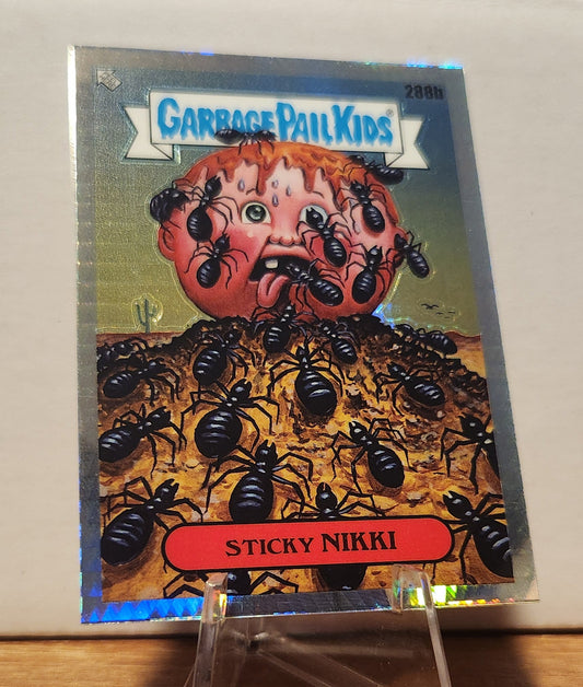 Garbage Pail Kids Sticky Nikki card featuring an illustration of a child covered in ants on a colorful background