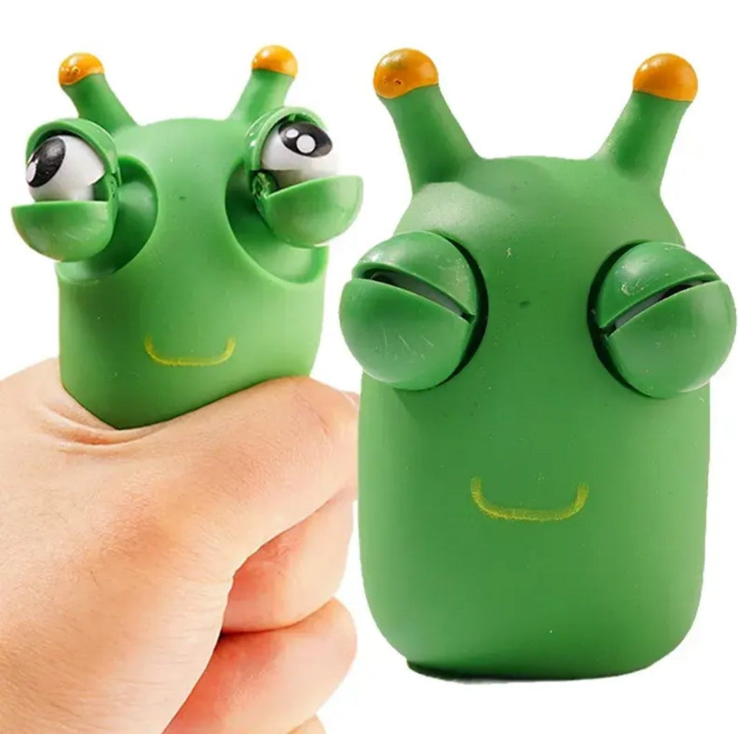Green squeeze worm toy designed for stress relief with playful features and soft texture