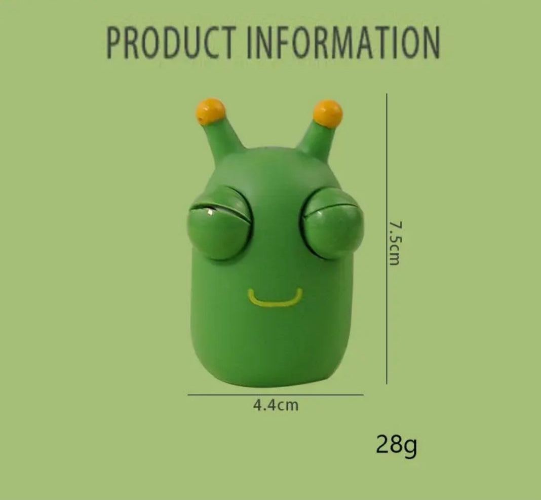 Green squeeze worm toy with smiling face, measuring 4.4cm by 7.5cm, perfect for stress relief