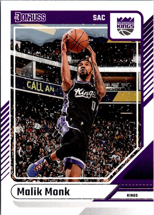 Malik Monk trading card featuring him shooting a basketball in Sacramento Kings uniform