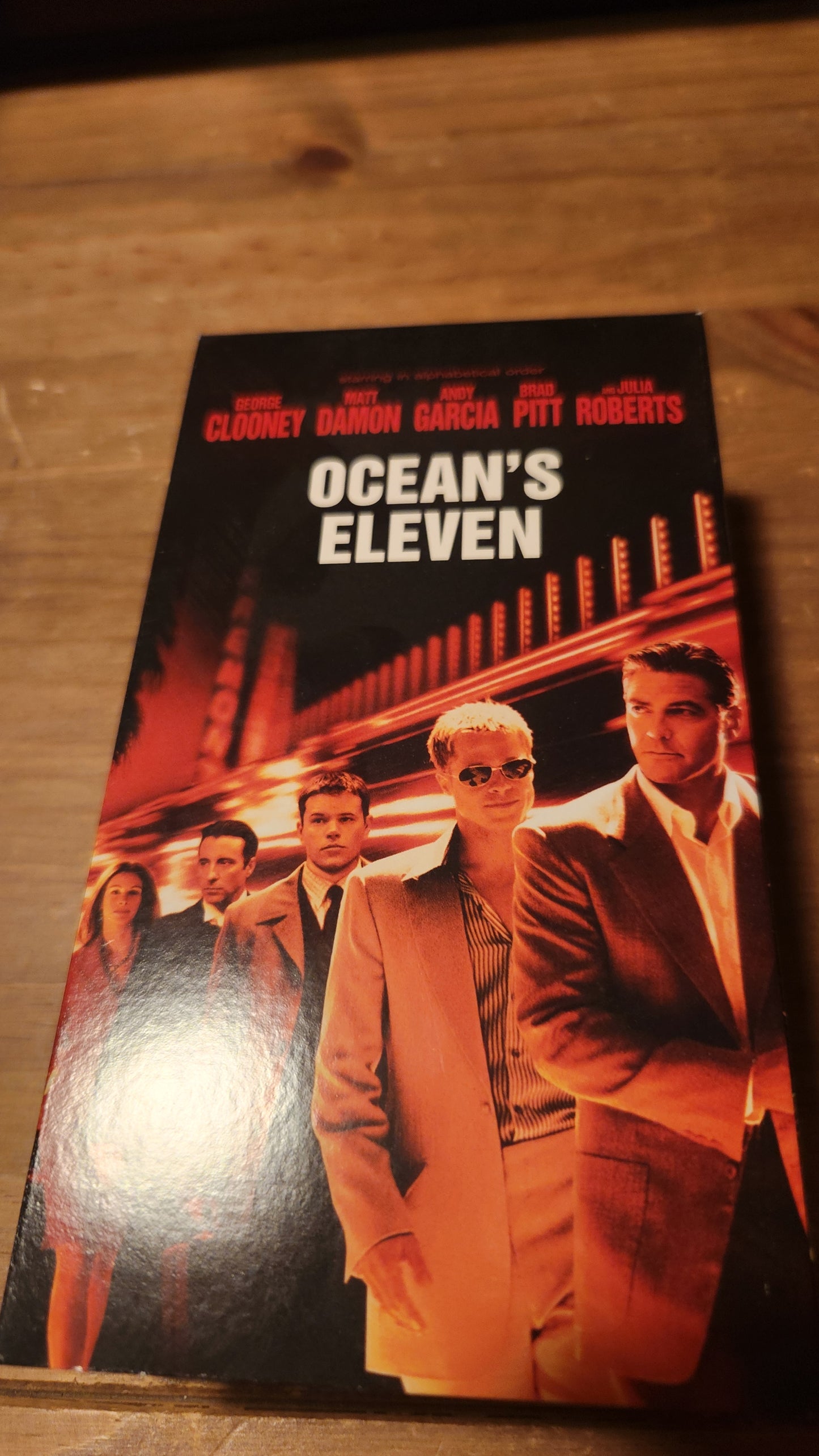 OCEAN'S ELEVEN VHS collectible featuring main cast on cover in stylish suits with city lights background