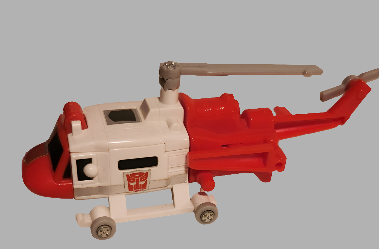Protectobots Transformers parts featuring a red and white helicopter toy with visible details