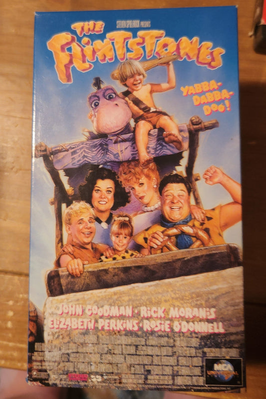 The Flintstones VHS tape from Lawrence's Collectibles featuring the live-action film cover with main characters and Yabba-Dabba-Doo text