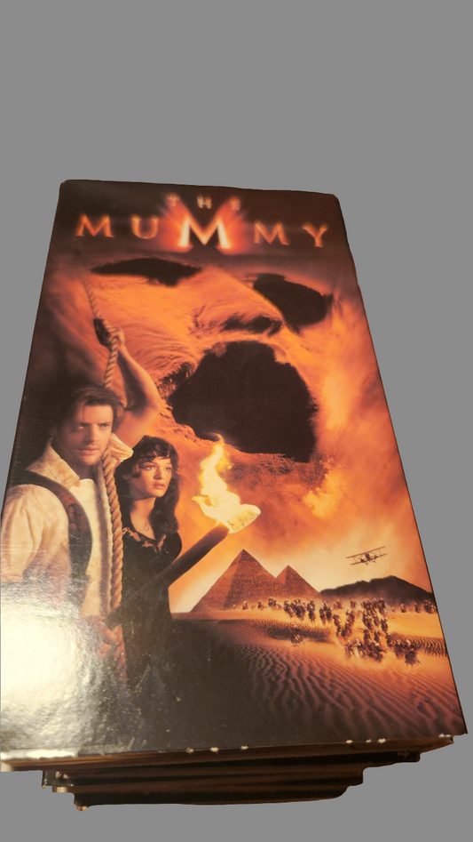 The Mummy VHS collectible featuring iconic artwork with the main characters against a desert backdrop