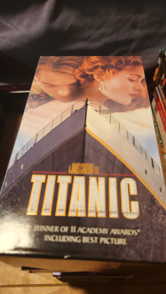 Titanic VHS collectible tape featuring movie cover with ship and lead characters by Lawrence's Collectibles