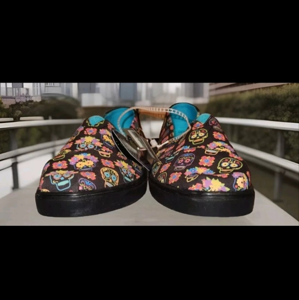 TOMS Dia De Los Muertos shoes featuring vibrant sugar skull designs for festive occasions