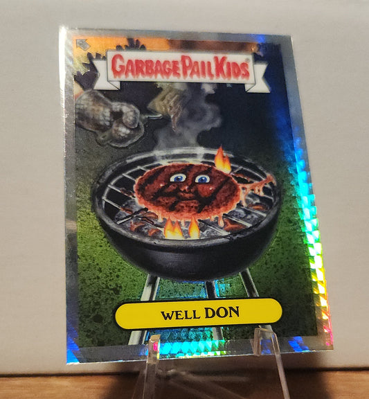 Well Done trading card- TOPPS GARBAGE PAIL KIDS featuring a humorous cartoon burger on a grill