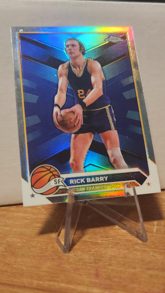 Topps Rick Barry trading card featuring basketball player in vintage San Francisco Warriors uniform
