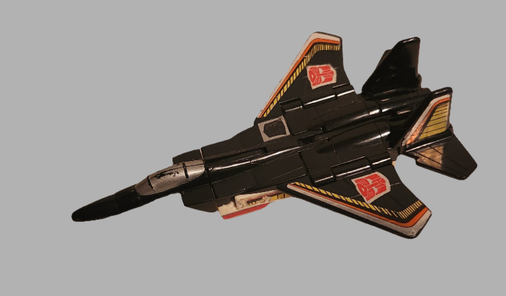 Airraid Transformers action figure in jet mode with detailed design and classic colors