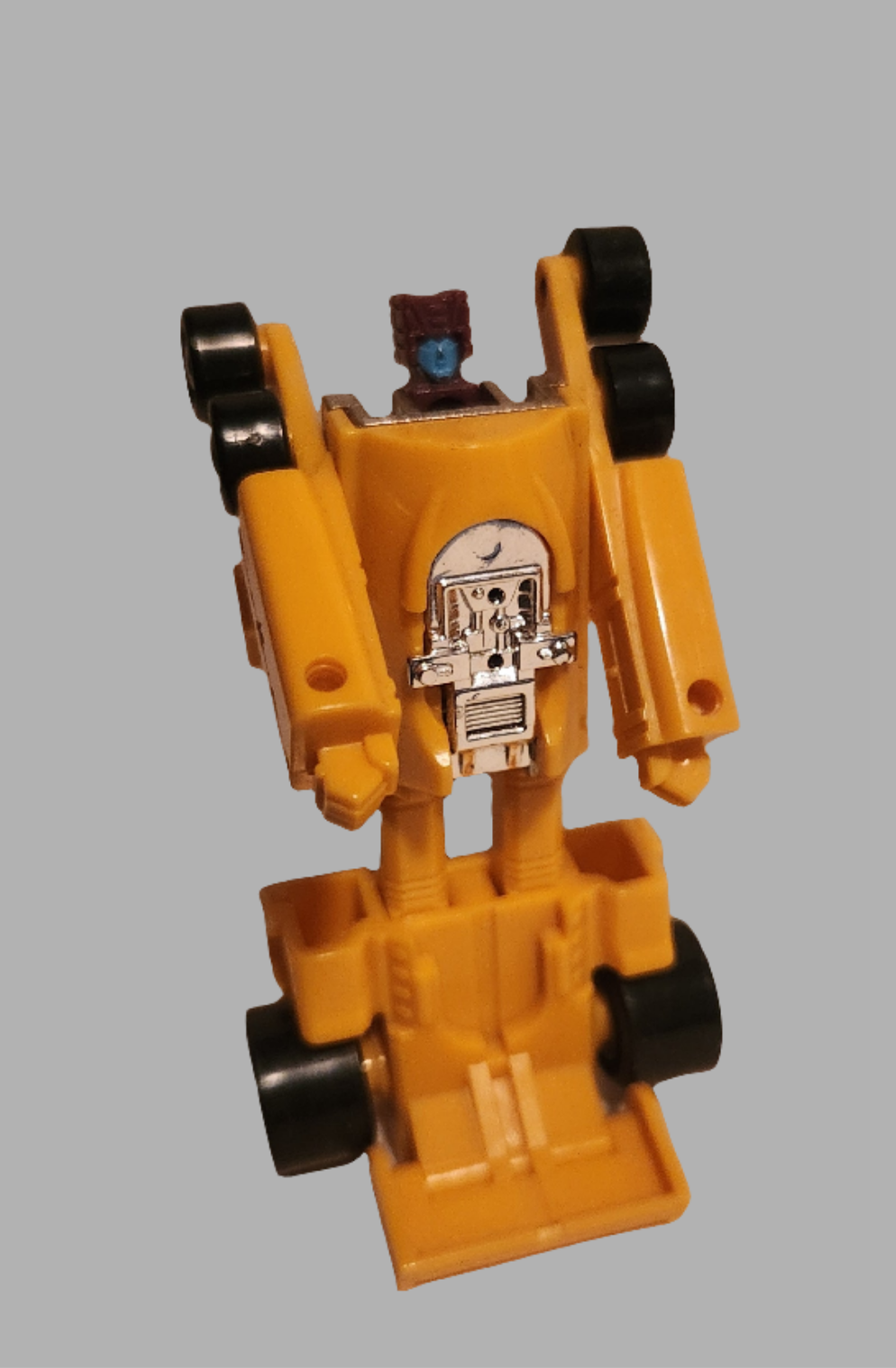 Vintage Drag Strip Transformers collectible in yellow with movable wheels and detailed design