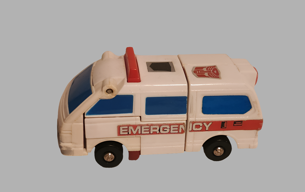 Transformers Protectobots First Aid toy in ambulance mode with emergency markings and red accents