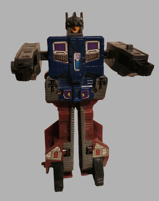 Transformers Quake toy in blue and red, featuring unique robotic design and articulation points
