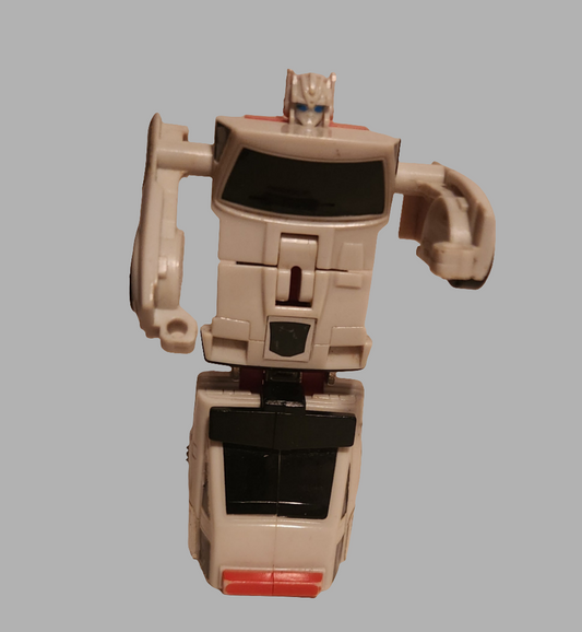 Vintage Transformers collectibles Optimus Prime action figure in white and red design from the 1980s