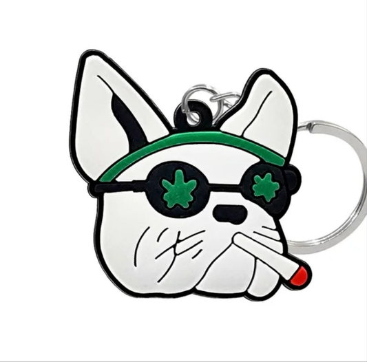 Weed-themed dog collectible keychain featuring a cartoon dog with sunglasses and a playful expression
