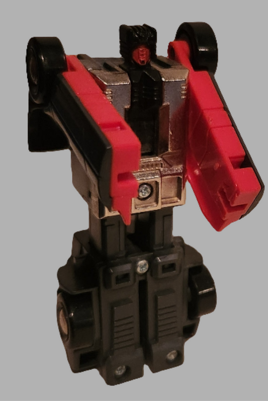 Wildride Stunticons Transformers toy in black and red with articulated limbs and detailed design
